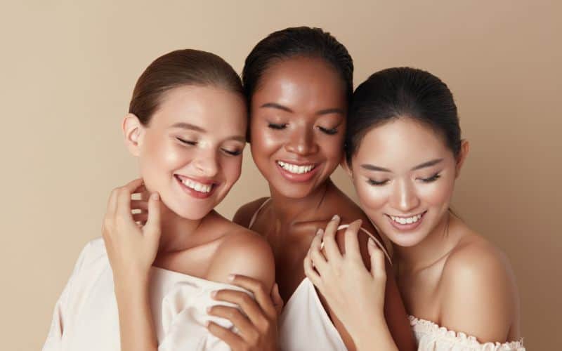 pure-collagen-powder-beauty-diverse-group-of-ethnic-women-portrait-happy-different-ethnicity-models-standing-together-with-closed-eyes-and-smiling-min